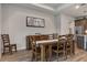 Inviting dining room featuring a large wooden table, perfect for hosting gatherings and creating memories at 9773 Sw 63Rd Loop, Ocala, FL 34481