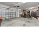 Spacious garage with multiple bays, epoxy flooring and motorcycle at 9773 Sw 63Rd Loop, Ocala, FL 34481