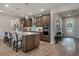 Modern kitchen with stainless steel appliances, pendant lighting, and center island with bar seating at 9773 Sw 63Rd Loop, Ocala, FL 34481