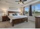 This main bedroom offers a ceiling fan, large windows and decor sign over the headboard at 9773 Sw 63Rd Loop, Ocala, FL 34481