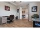 Spacious office with desk, wood floors, and an open doorway at 9773 Sw 63Rd Loop, Ocala, FL 34481