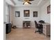 Home office with tray ceiling, wood floors, and a comfortable workspace at 9773 Sw 63Rd Loop, Ocala, FL 34481
