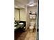 Hotel bathroom featuring a double sink vanity with a black countertop and tile flooring at 3000 Maingate Ln # 420, Kissimmee, FL 34747