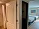 Hotel bathroom featuring a shower and open doorway to the bedroom with two beds at 3000 Maingate Ln # 420, Kissimmee, FL 34747
