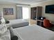 Comfortable hotel bedroom with two beds, TV, and workstation at 3000 Maingate Ln # 420, Kissimmee, FL 34747