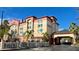 Galleria Palms Resort exterior view showcasing its architecture, landscaping, and signage at 3000 Maingate Ln # 420, Kissimmee, FL 34747