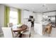 Eat-in kitchen with island, stainless appliances, and dining area at 1262 Whispering Ln, Minneola, FL 34715