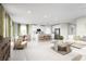 Bright, open living area with stylish decor and seamless flow into kitchen and dining at 1262 Whispering Ln, Minneola, FL 34715