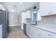 Modern kitchen featuring white cabinetry, stainless steel appliances, and quartz countertops at 17975 Se 106Th Ct, Summerfield, FL 34491