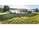 Charming single-story home featuring a screened porch and spacious, well-maintained backyard at 17975 Se 106Th Ct, Summerfield, FL 34491