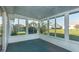 Enclosed sunroom with bright windows at 17975 Se 106Th Ct, Summerfield, FL 34491
