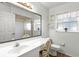Clean bathroom with a large mirror, bright lighting, and neutral finishes at 12 Almond Ter, Ocala, FL 34472