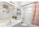 Well lit bathroom with decorative shower curtain, plant, and plenty of light at 12 Almond Ter, Ocala, FL 34472