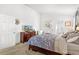 Cozy bedroom with neutral colors, a comfortable bed, and ample natural light at 12 Almond Ter, Ocala, FL 34472