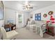 Bright bedroom features a ceiling fan, a daybed and plenty of natural light from the large window at 12 Almond Ter, Ocala, FL 34472