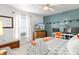 Stylish bedroom with a modern accent wall, workspace, and a comfortable seating area at 12 Almond Ter, Ocala, FL 34472