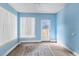 Bonus room with lots of light, blue walls, and a decorative rug on the floor at 12 Almond Ter, Ocala, FL 34472