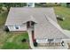 Charming home featuring light-colored siding, a well-maintained roof, and a tidy front lawn at 12 Almond Ter, Ocala, FL 34472