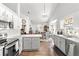 Open-concept kitchen with stainless steel appliances overlooking the dining area and living room at 12 Almond Ter, Ocala, FL 34472