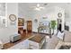 Cozy living room with a ceiling fan, a comfortable sofa, and a wooden coffee table at 12 Almond Ter, Ocala, FL 34472