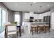 Bright eat-in kitchen with modern appliances, granite countertops, and a dining nook at 1314 Whispering Ln, Minneola, FL 34715