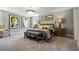 Spacious main bedroom featuring soft neutral colors, art, and comfortable furniture at 3828 Denali Dr, Apopka, FL 32712