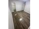 Bedroom featuring wood-look flooring, fresh paint, and natural light at 722 E Michigan St # 145, Orlando, FL 32806