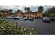 Condominium building with a parking lot in front at 722 E Michigan St # 145, Orlando, FL 32806