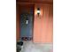 Entrance to unit with a storm door, outdoor light fixture, and a welcome mat at 722 E Michigan St # 145, Orlando, FL 32806