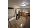 Kitchen features stainless steel appliances, and washer/dryer at 722 E Michigan St # 145, Orlando, FL 32806