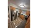 Kitchen features stainless steel appliances and wood-look flooring at 722 E Michigan St # 145, Orlando, FL 32806