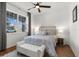 Cozy bedroom filled with natural light featuring a ceiling fan and neutral decor at 8750 Sw 79Th Loop, Ocala, FL 34481