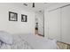 Neutral bedroom with light-colored walls, ceiling fan, and closet at 8750 Sw 79Th Loop, Ocala, FL 34481