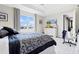 Comfortable bedroom with a large window, ceiling fan, and neutral tones for a calming atmosphere at 8750 Sw 79Th Loop, Ocala, FL 34481