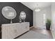 Elegant foyer boasts decorative mirrors and a sleek white cabinet at 8750 Sw 79Th Loop, Ocala, FL 34481