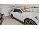 Spacious garage with storage cabinets offers ample space for vehicles and organization at 8750 Sw 79Th Loop, Ocala, FL 34481