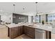 Open-concept kitchen features a large island, modern appliances, and seamless living space at 8750 Sw 79Th Loop, Ocala, FL 34481