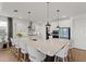 Open kitchen with a large island featuring barstool seating and modern appliances at 8750 Sw 79Th Loop, Ocala, FL 34481