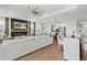 Spacious living area features a cozy fireplace, modern furniture, and open floor plan at 8750 Sw 79Th Loop, Ocala, FL 34481
