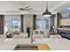 Bright living area with comfortable seating, a fireplace, and large windows at 8750 Sw 79Th Loop, Ocala, FL 34481