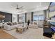 Bright living room features modern decor, a large area rug, and plenty of natural light at 8750 Sw 79Th Loop, Ocala, FL 34481