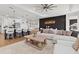 Open-concept living area with a large island, modern lighting, and stylish decor at 8750 Sw 79Th Loop, Ocala, FL 34481