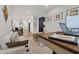 Inviting living room with workspace with easy access to the bright open kitchen at 8750 Sw 79Th Loop, Ocala, FL 34481