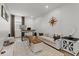Bright living room features stylish decor, comfortable seating, and a functional workspace at 8750 Sw 79Th Loop, Ocala, FL 34481
