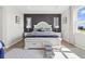 Beautifully decorated main bedroom with a stylish black accent wall and natural light at 8750 Sw 79Th Loop, Ocala, FL 34481