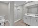 Modern bathroom featuring double vanity, marble shower, and neutral tones at 20995 Sw 93Rd Lane Rd, Dunnellon, FL 34431