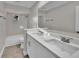 Bathroom featuring double sinks, modern fixtures, and a tiled shower-tub combo at 20995 Sw 93Rd Lane Rd, Dunnellon, FL 34431