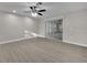 Light-filled bedroom with wood flooring and a sliding glass door at 20995 Sw 93Rd Lane Rd, Dunnellon, FL 34431