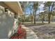 Charming home featuring a winding walkway and mature trees in a landscaped front yard at 20995 Sw 93Rd Lane Rd, Dunnellon, FL 34431
