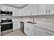 Updated kitchen featuring stainless steel appliances and white cabinets at 20995 Sw 93Rd Lane Rd, Dunnellon, FL 34431